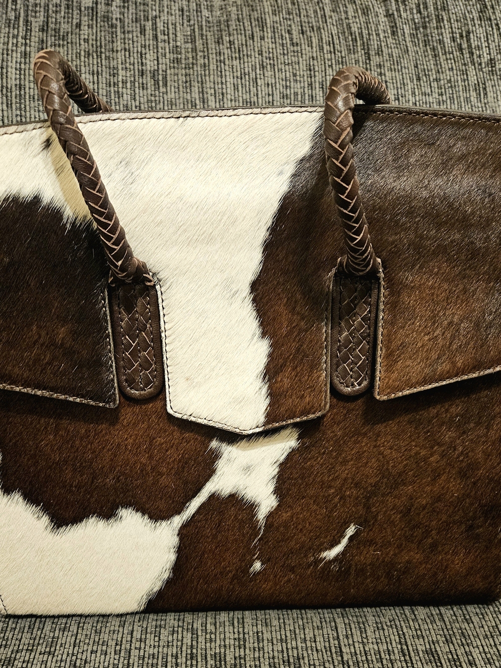 Brown and White Cowhide Tote with Braided Handles